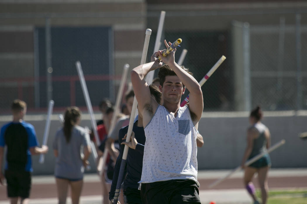 Edward &quot;Teddy&quot; Andrews does warmup runs prior to pole vaulting during a tr ...