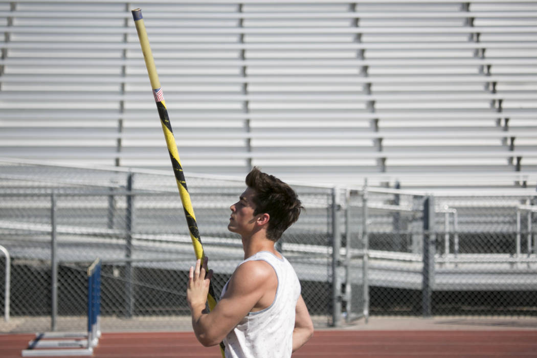 Edward &quot;Teddy&quot; Andrews does warmup runs prior to pole vaulting during a tr ...