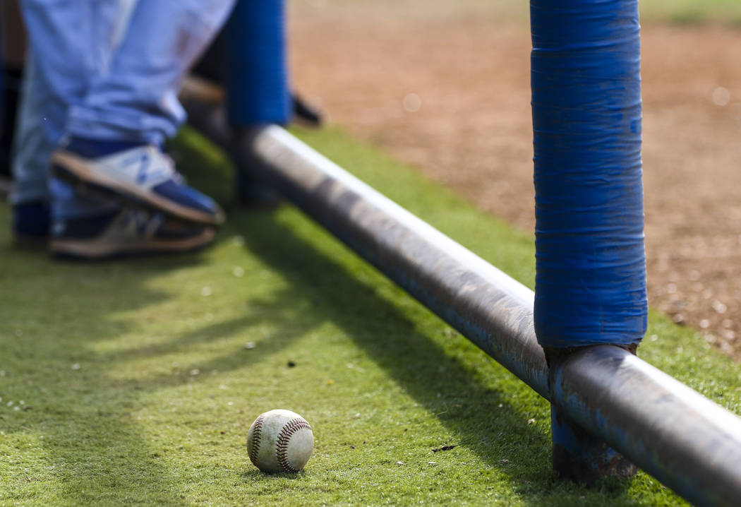A baseball sits in the Basic High School dugout during a baseball game against Green Valley ...