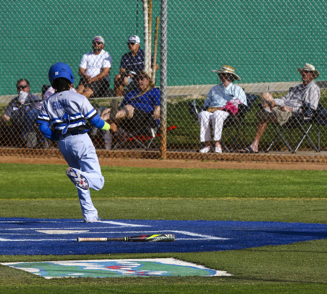 Basic second baseman Jathan Sibal (1) makes the run in the fourth inning during a baseball g ...