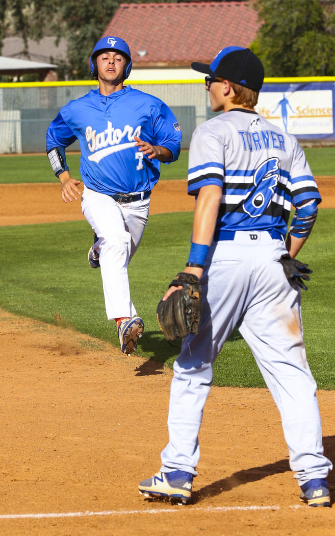 Green Valley outfielder Austin Primack (7) runs past Basic third baseman Kyle Turner (8) to ...