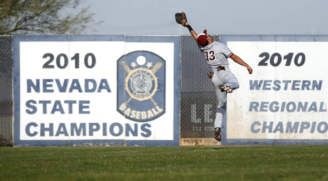Desert Oasis’s Nic Lane (13) catches a fly ball during the fifth inning of a high scho ...