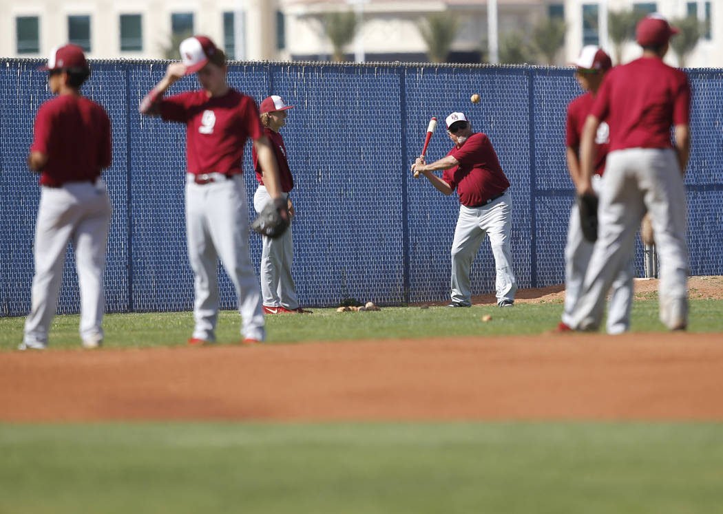 Desert Oasis players warm up before a high school baseball game against Sierra Vista at Sier ...