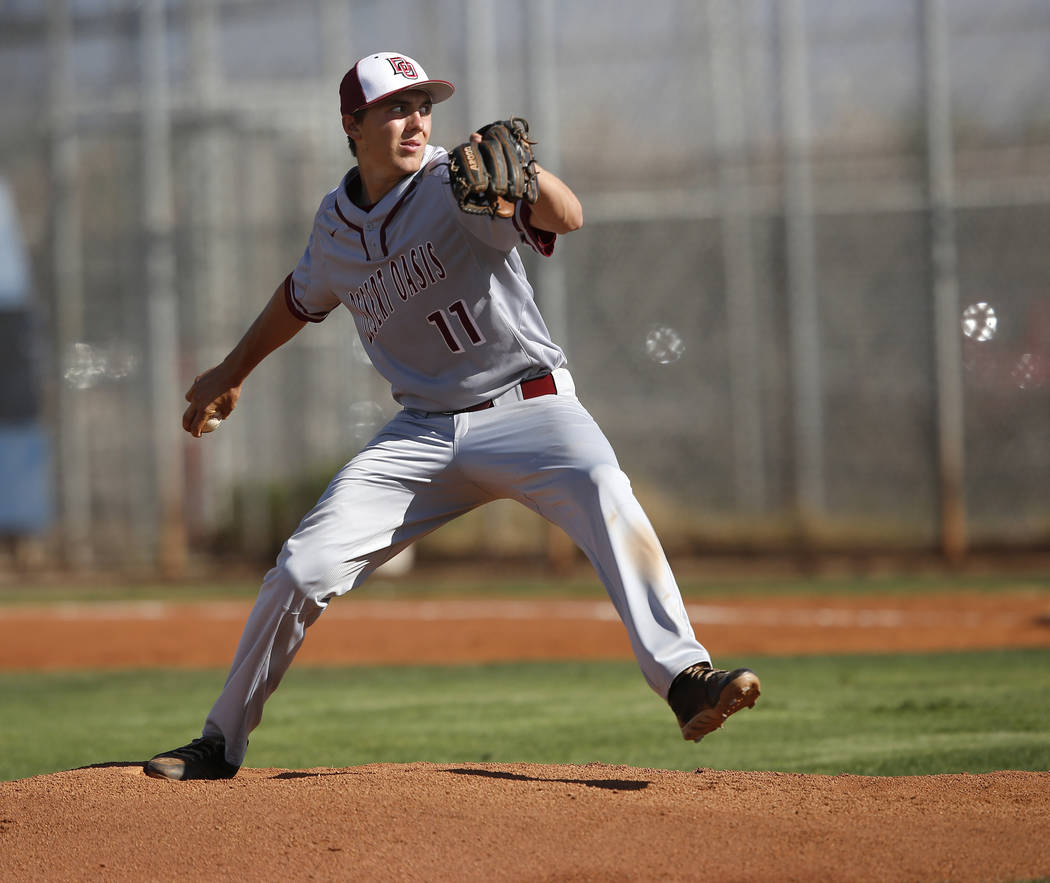 Desert Oasis’s Brett Brocoff (11) pitches during the first inning of a high school bas ...