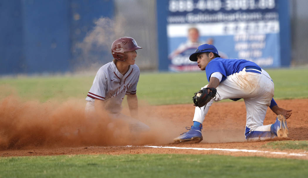 Desert Oasis’s Cole Schaefer (10) is safe at third base after a late catch by Sierra V ...