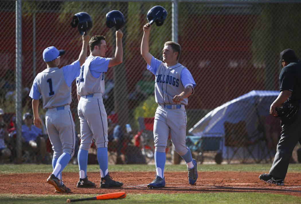 Centennial’s Austin Kryszczuk (17), right, celebrates his home run hit during a baseba ...