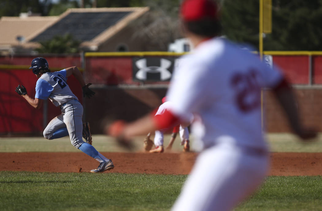 Centennial’s Brett Berger (20) runs for third base during a baseball game against Arbo ...