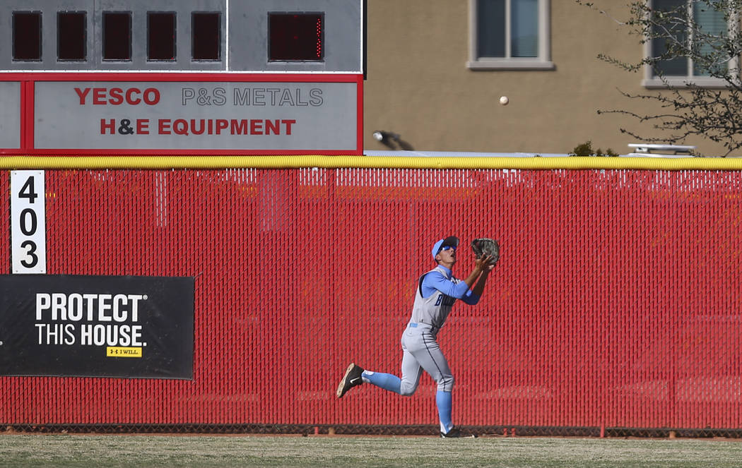 Centennial’s Gino Sabey (12) catches a fly ball from Arbor View’s Joe Fitzhugh ( ...