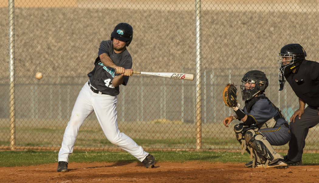 Silverado first baseman Michael Janosik (42) hits the ball in the fifth inning during a base ...