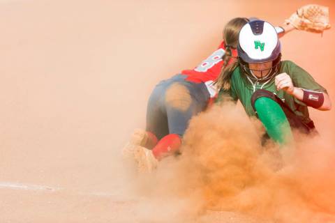 Palo Verde’s Makena Martin, right, slides into third base successfully as Arbor View&# ...