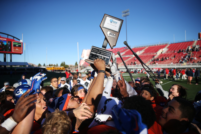 Bishop Gorman celebrates its against Liberty in the Class 4A state football championship gam ...