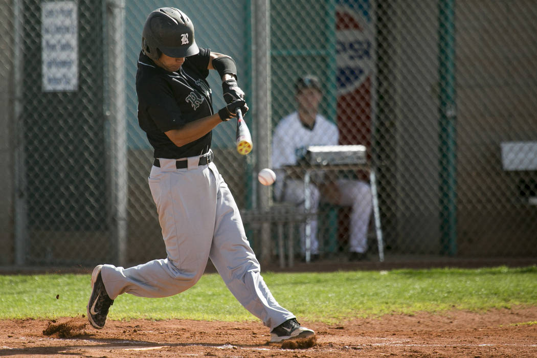 Rancho junior Anthony Guzman (27) swings at the ball during a game against Silverado at Silv ...