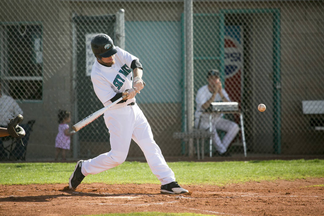 Silverado senior Payton Ballard (29) swings at the ball during a game against Rancho at Silv ...