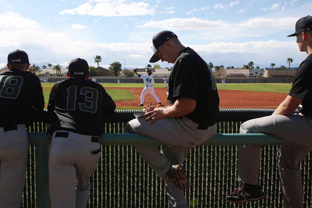 Rancho baseball teammates prepare for a game against Silverado at Silverado High School on T ...