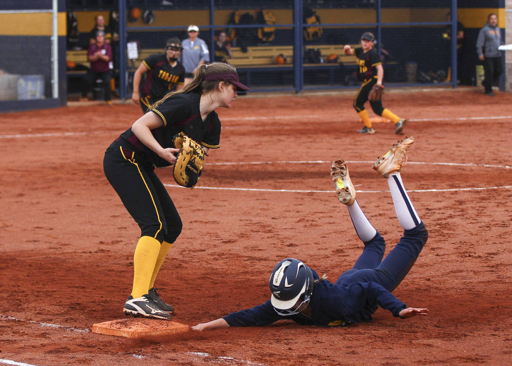Pahrump’s Jill Smith (8) tags out Boulder City’s Ellie Ramsey (3) at first base ...