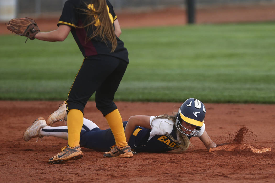 Boulder City’s Ashley Wishard (8) makes it safely back to second base during a softbal ...