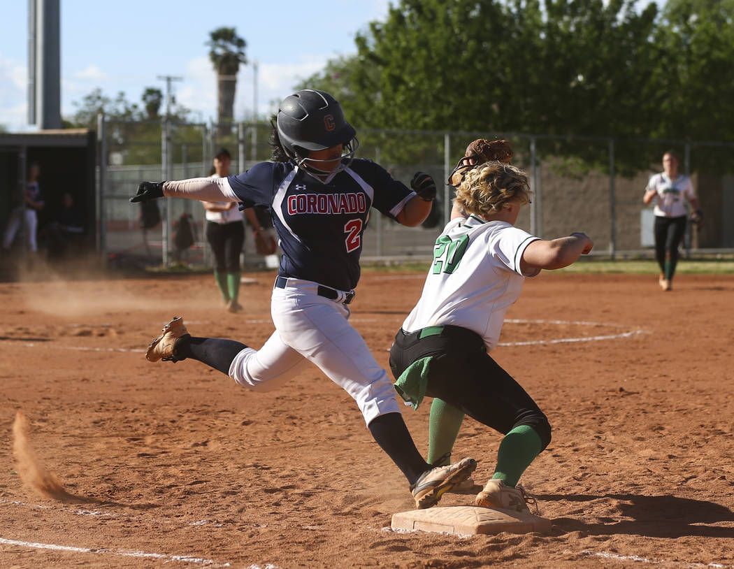 Rancho’s MacKenzie Perry (20) catches the throw to get out Coronado’s Alexis Oka ...