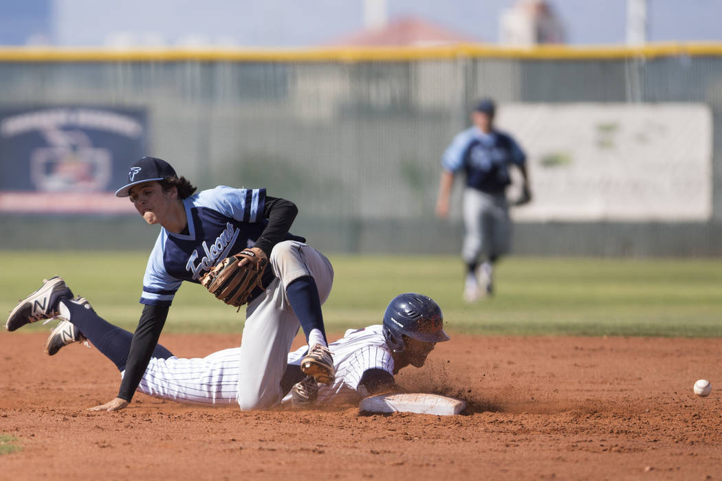 Coronado’s Jake McLean (17) slides safely to second base against Foothill’s Bray ...