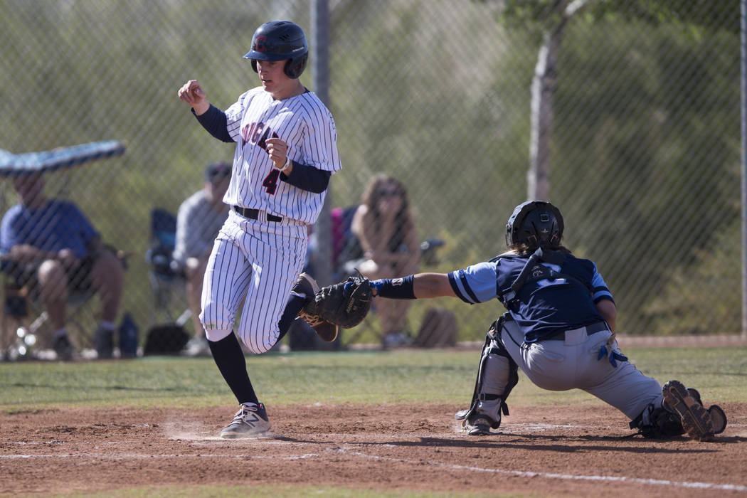 Coronado’s Kyle Hall(4) runs home for a score against Foothill in their baseball game ...