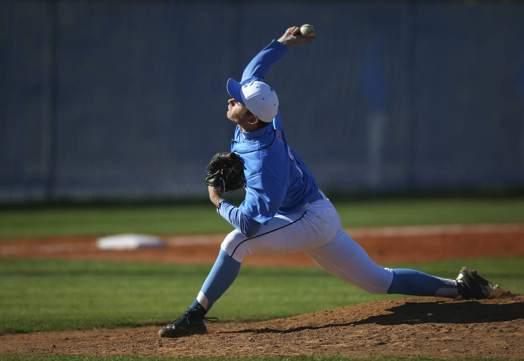 Centennial’s Garrett Holden (21) pitches to Cimarron-Memorial during a baseball game a ...