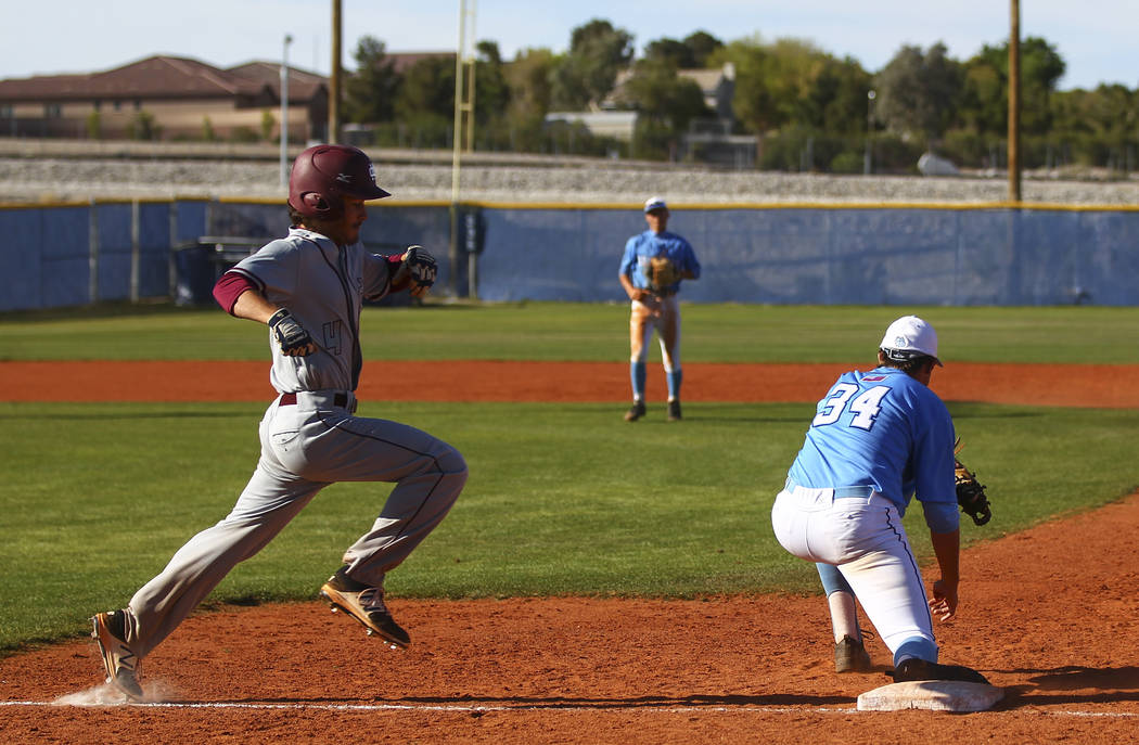 Centennial’s Kyle Horton (34) tags out Cimarron-Memorial’s Derek Decolati (4) at ...