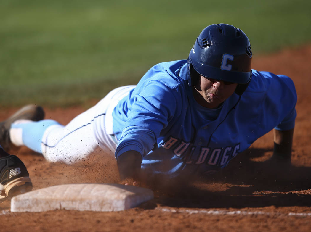 Centennial’s Kyle Horton (34) returns to first base to stay safe during a baseball gam ...