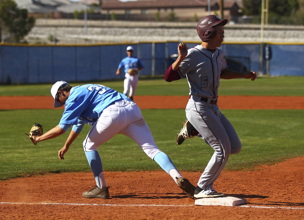 Centennial’s Kyle Horton (34) gets out Cimarron-Memorial’s Jackson Folkman (6) a ...