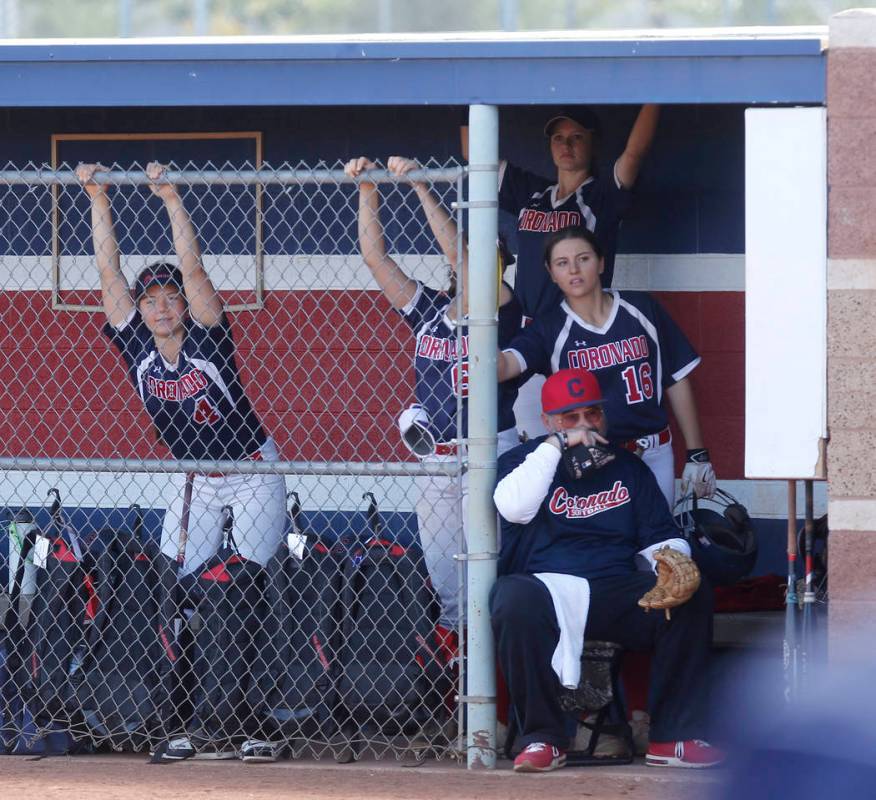 Coronado players watch the game from the dugout during the fourth of a high school softball ...