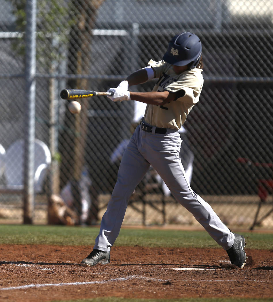 Spring Valley’s Chase Rodriguez (22) swings during the third inning of a high school b ...
