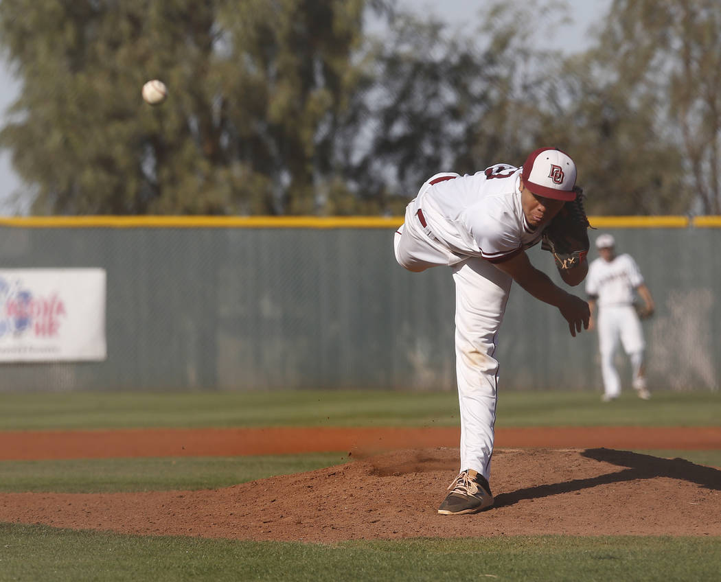 Desert Oasis’s Aaron Roberts (25) pitches during the fifth inning of a high school bas ...