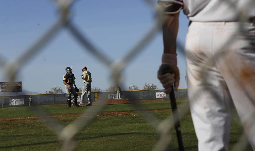 Spring Valley’s Jaxson Otis (5) talks to the back catcher during the sixth inning of a ...