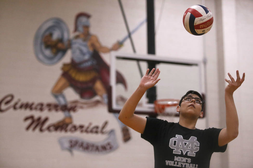 Senior setter Edher Aldaco prepares to hit the ball during volleyball practice at Cimarron-M ...