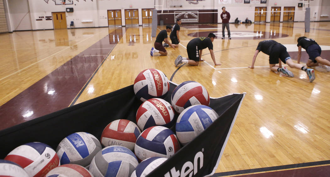 Cimarron-Memorial High School volleyball team works out during practice at the school on Fri ...