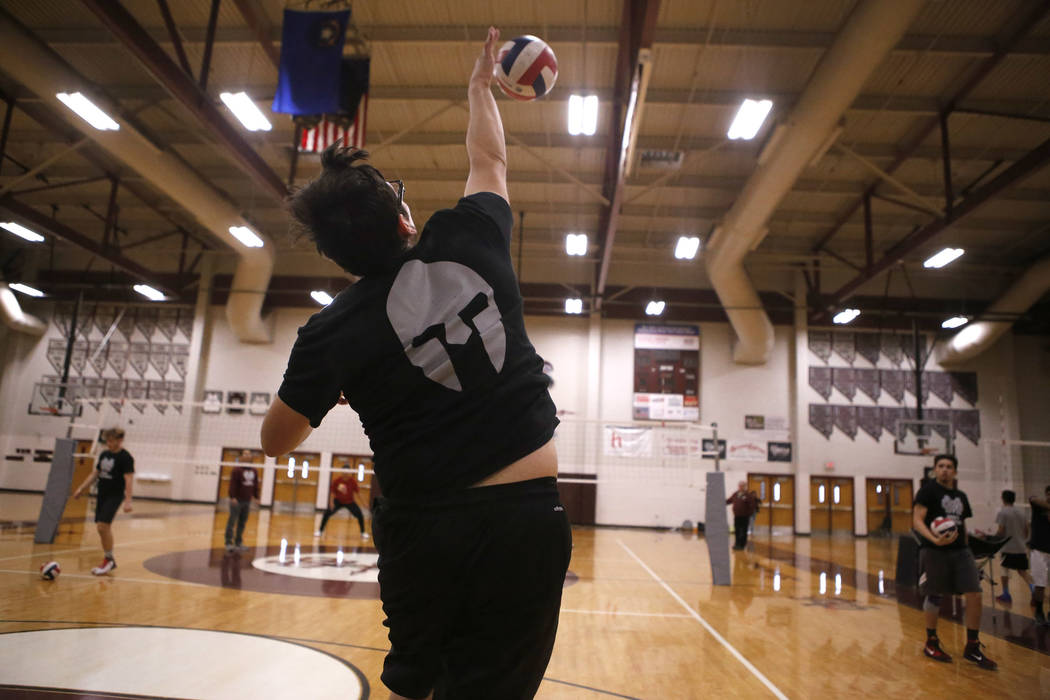 Senior setter Edher Aldaco hits the ball during volleyball practice at Cimarron-Memorial Hig ...