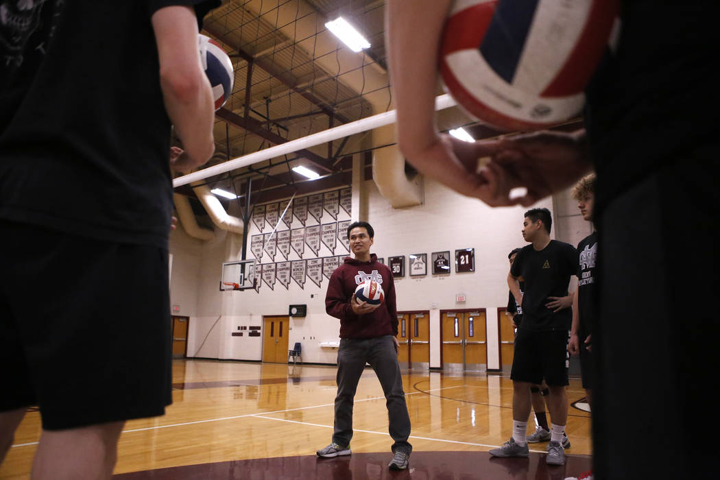 Head coach Sopheap Khuon speaks to the volleyball team during practice at Cimarron-Memorial ...