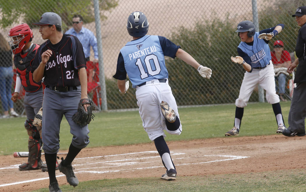 Foothill’s Chayse Parenteau (10) scores a run during the first inning of a high school ...