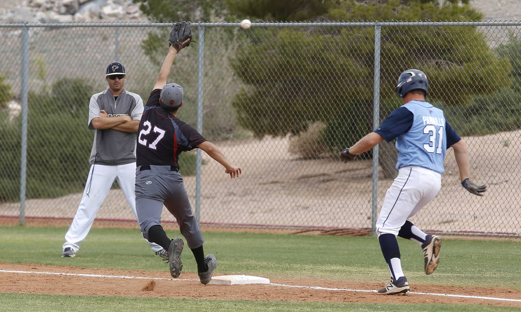 Foothill’s Anthony Pannullo (31) is safe at first base as Las Vegas’s Diego Delg ...