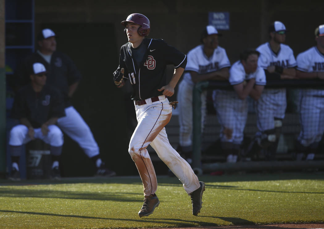 Desert Oasis’ Brett Brocoff (11) heads to home base to score a run against Jordan duri ...
