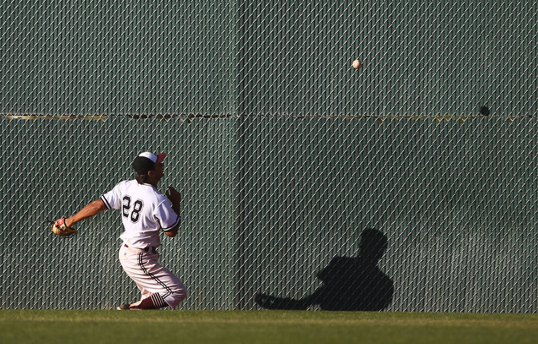 Jordan’s Hunter Swapp (28) comes up short on a fly ball from Desert Oasis during the B ...