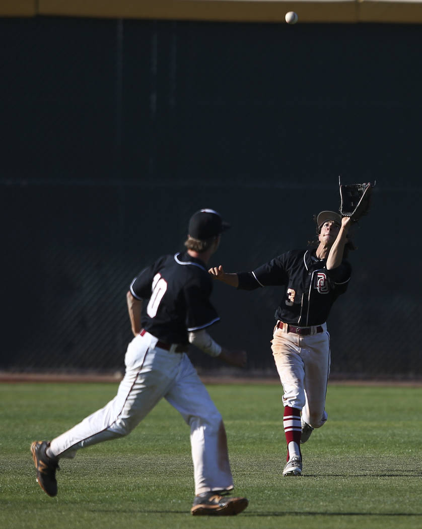 Desert Oasis’ Kyle Fuentes (3) catches a fly ball from from Jordan’s Gage Edward ...
