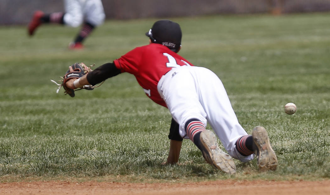 Banning’s Omar Muro (11) misses a catch during the fifth inning of a high school baseb ...