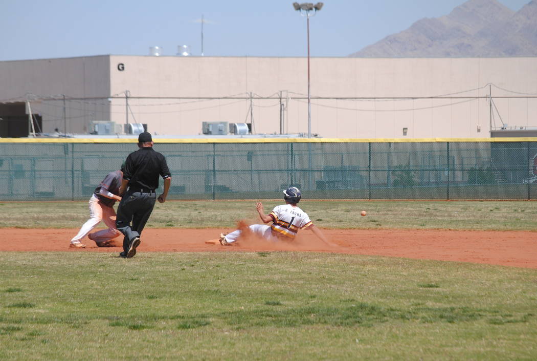 Pahrump Valley’s Garrett Lucas slides safely into second base on Wednesday. The Trojan ...