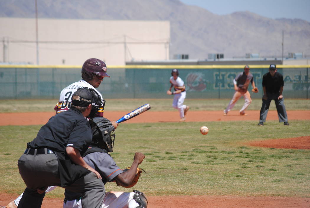 A Pahrump Valley player takes a pitch on Wednesday. The Trojans beat Mojave 5-0 to capture t ...