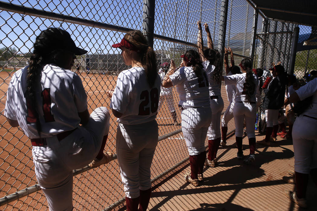Desert Oasis players in a dugout during a high school softball game at Majestic Park on Thur ...