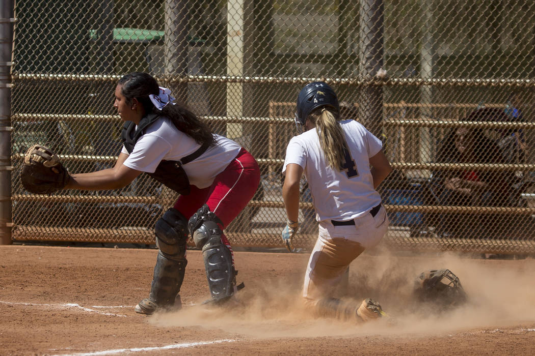 Shadow Ridge sophomore Shea Clements slides safely into home during a game against Banning a ...