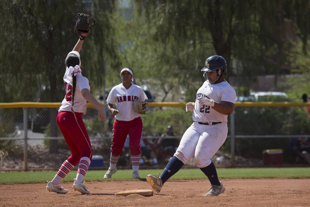 Shadow Ridge sophomore Alyssa Stanley safely makes it to second base during their game again ...