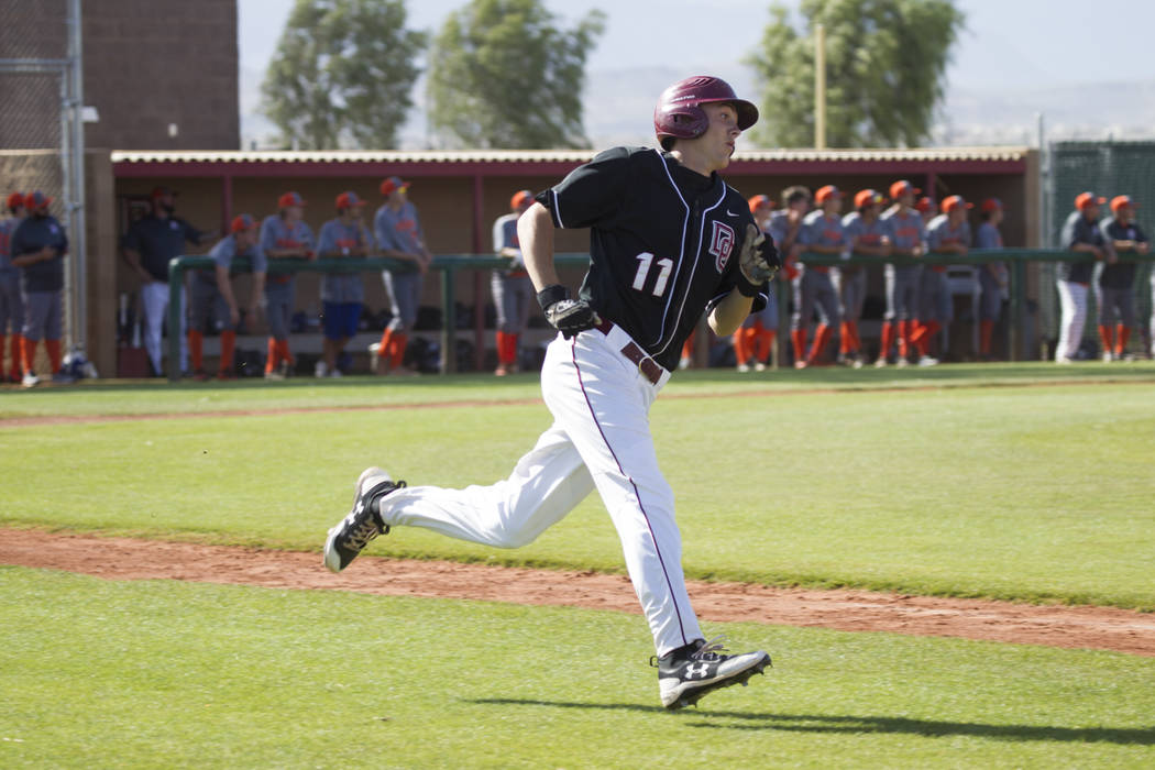 Desert Oasis’ Brett Brocoff (11) rounds the bases after hitting a homer against Bishop ...