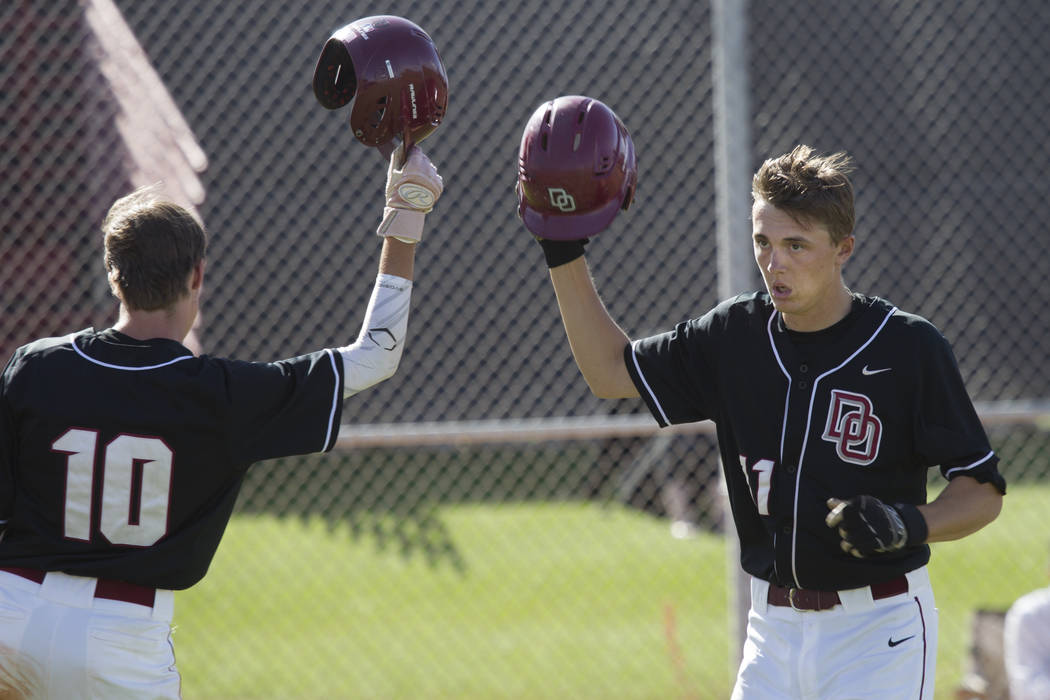 Desert Oasis’ Brett Brocoff (11) celebrates after hitting a homer against Bishop Gorma ...