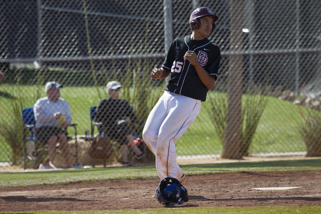 Desert Oasis’ Max Prescott (25) runs home for a run against Bishop Gorman at Desert Oa ...