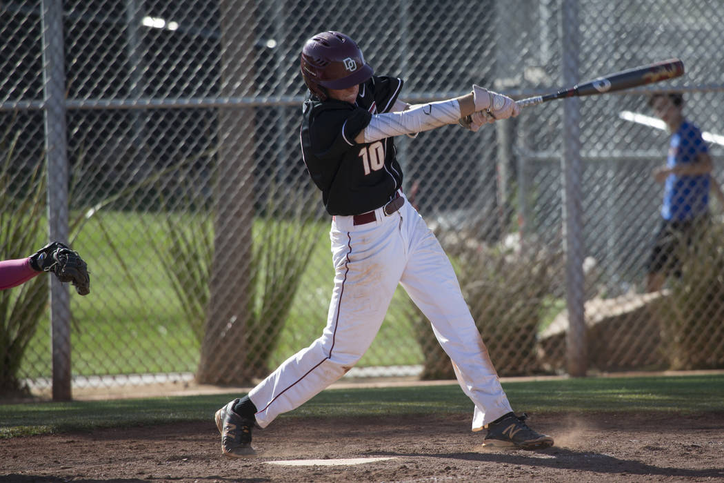 Desert Oasis’ Cole Schaefer (10) swings the bat against Bishop Gorman at Desert Oasis ...